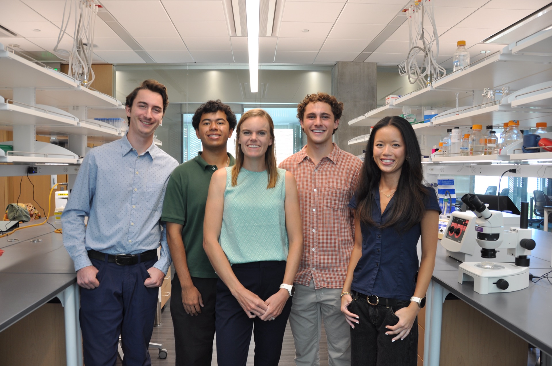 Dr. Dann with Dann Lab members in the laboratory, Summer 2026