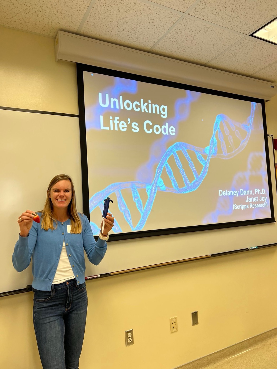 Dr. Delaney Dann presenting Unlocking Life's Code in a classroom