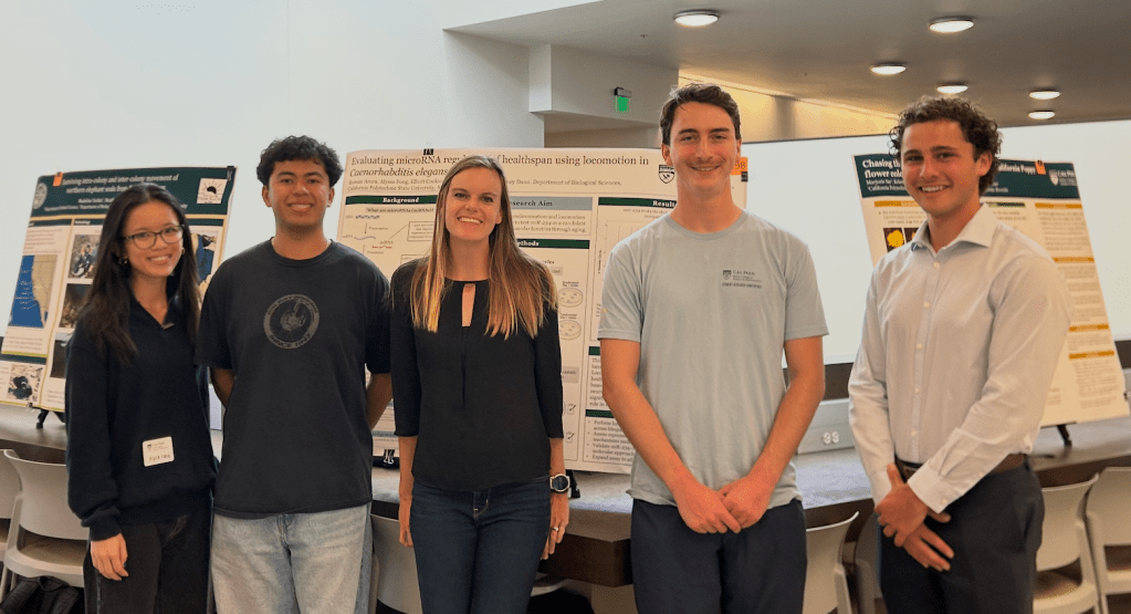 Dr. Dann with research students at the Spring 2026 Bailey College Student Research Conference